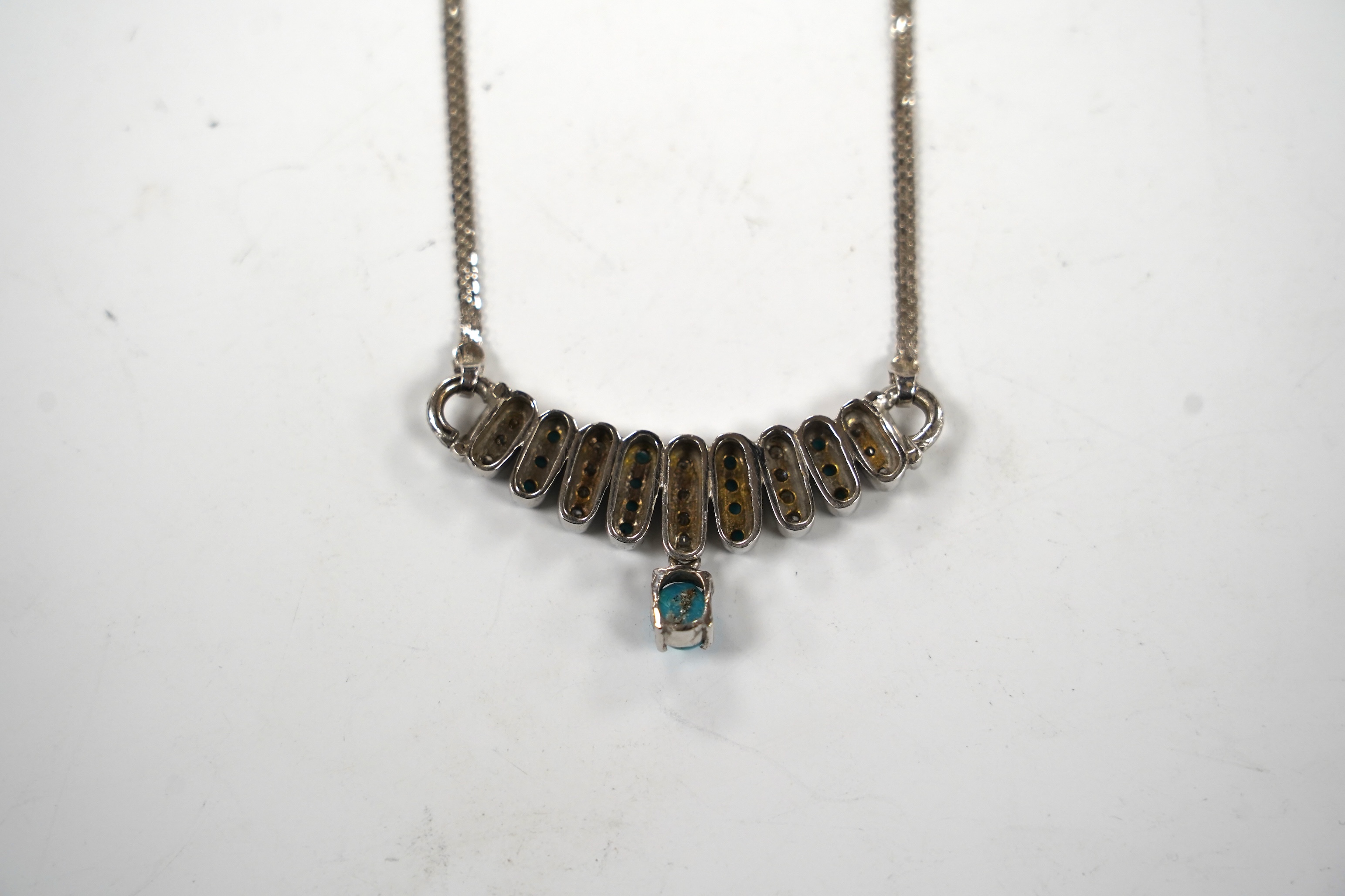 A modern Italian 750 white metal turquoise and diamond cluster set drop necklace, 40cm gross weight 17.1 grams.